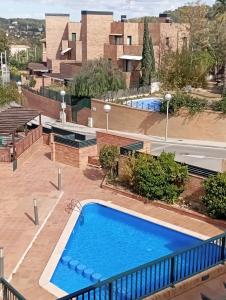 a view of a swimming pool on top of a building at Arrabassada in Tarragona