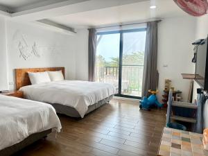 Postelja oz. postelje v sobi nastanitve Nanwan254 Homestay