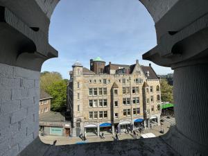 a view of a large brick building from a window at Di-Ann City Centre Hotel in Amsterdam