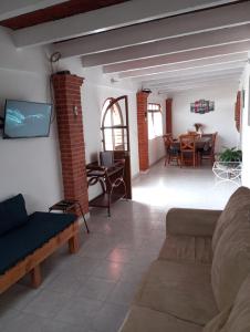 a living room with a couch and a table at Los Malvones in Tequisquiapan
