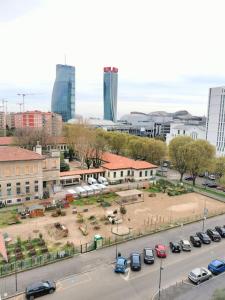 a view of a city with cars parked in a parking lot at Casa Mila in Milan
