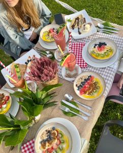 a picnic table with plates of food on it at Hotel Gerra Mayor in San Vicente de la Barquera