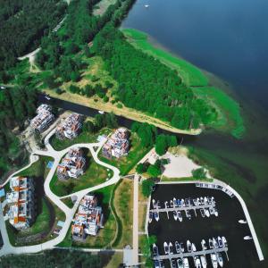 an aerial view of a parking lot next to the water at Nautica Resort in Giżycko