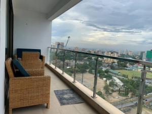 a balcony with a view of a city at Kitengule Apartment 002 in Dar es Salaam