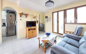 a living room with a couch and a table at 3 Bedroom Cozy Home In Peñíscola in Peñíscola