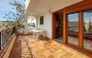 an open balcony with a table on a patio at 3 Bedroom Cozy Home In Peñíscola in Peñíscola +12 photos