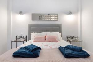מיטה או מיטות בחדר ב-Ático Margarita