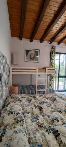 a bedroom with a bed and a bunk bed at Voscenza Benerica in Vittoria