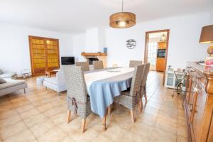 a kitchen and dining room with a table and chairs at Laelydi in Amboise +17 photos