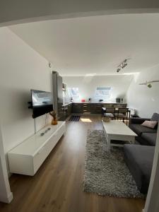 a living room with a couch and a table at T3 2chambres - place de Parking-WIFI - Hyper centre in Amiens