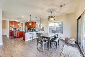 a kitchen with a table and chairs in a room at Expansive Mesa Retreat with Private Outdoor Pool! in Mesa