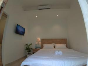 Postel nebo postele na pokoji v ubytování Uma Menuh Surf House