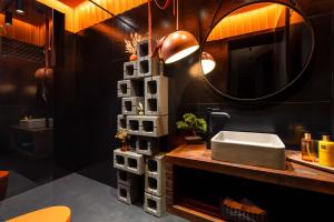 a bathroom with a sink and a mirror at Win Herastrau - Luxury Design 2BR Apartment - Parking in Bucharest +91 photos
