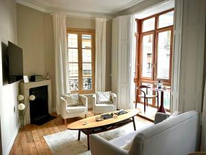 a living room with a couch and a table at Monappart Cristo Historic Apartment with Parking in Bilbao