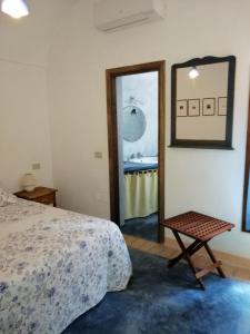 Ένα ή περισσότερα κρεβάτια σε δωμάτιο στο Holiday home Dammuso Magia