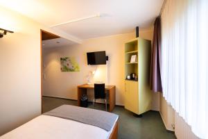 Ein Bett oder Betten in einem Zimmer der Unterkunft Select Hotel Silence Garden Köln