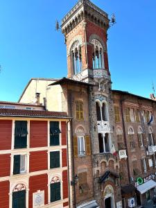 an old building with a clock tower on top of it at La bella vista in Sestri Levante