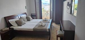 Postel nebo postele na pokoji v ubytování Amalia Studios