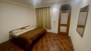 Postelja oz. postelje v sobi nastanitve Nomadic Den Manali