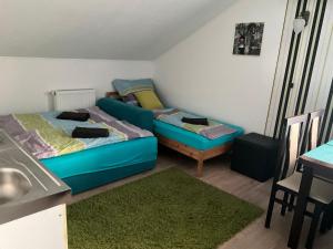a living room with a couch and a bed at Silver Bike Motel in Velden am Wörthersee