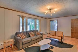 a living room with a couch and a chair at Parkstrip Place, Pet Friendly Downtown Home in Anchorage
