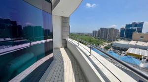 a balcony of a building with a swimming pool at Luxury Apartamento Hilton WI-FI, TV, Piscina y Gym in Barranquilla