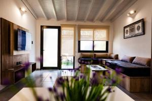 a living room with a couch and a table at Casa Wineland Logde West 4Pax - by Inside in Ciudad Lujan de Cuyo