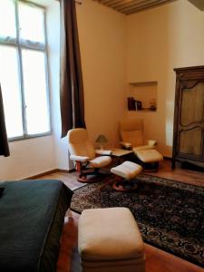 Posezení v ubytování chambres d'hôtes l'atrium