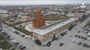 an aerial view of a large building with a clock tower at Арарат Голд in Agamzalu