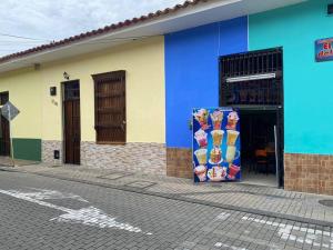 a colorful building on the side of a street at Casa Aparicio in Buga