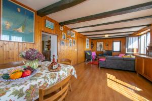 a living room with a table with fruit on it at Chalet Cademario - Happy Rentals in Cademario