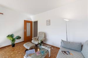 Posezení v ubytování Garden on the lake 2 - Happy Rentals + 17 fotografií
