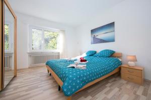 Postel nebo postele na pokoji v ubytování Bellevue Apartment - Happy Rentals