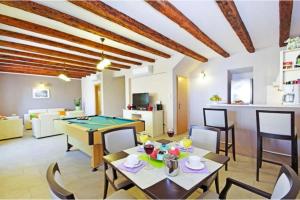 a living room with a ping pong table at Luxury Panorama Villa Dia in Brsečine