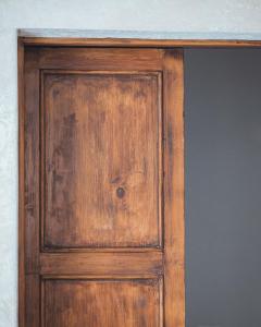 a wooden door with a stone counter on top at C'era una Volta Apartments in Bisceglie