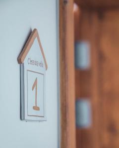 a sign on a wall with a house on it at C'era una Volta Apartments in Bisceglie