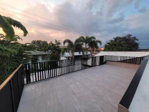 a balcony of a house with a fence at Jay's Villa 2 (Friendship) in Angeles