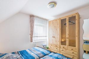 Ένα ή περισσότερα κρεβάτια σε δωμάτιο στο Ferienhaus Christa - Falshöft