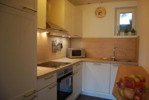 Kuchyň nebo kuchyňský kout v ubytování Ferienwohnung mit Pool in Wörthersee Nähe