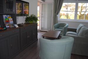 Posezení v ubytování Ferienwohnung mit Pool in Wörthersee Nähe