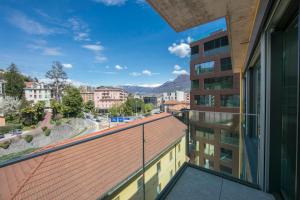 a balcony with a view of a city at Urban Apartment Paradiso with Balcony and Parking - Happy Rentals in Paradiso