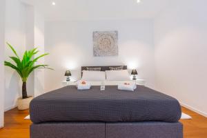 Postel nebo postele na pokoji v ubytování Love of Lugano - Happy Rentals