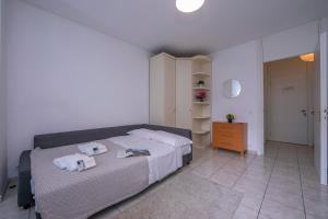 Postel nebo postele na pokoji v ubytování Residence Palace - Happy Rentals