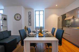 a dining room and kitchen with a table and chairs at Little Lugano - Happy Rentals in Lugano