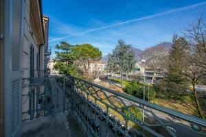 a balcony of a building with a view of a street at Little Lugano in Lugano