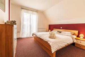 a bedroom with a bed and a large window at Sunny Weekend Sauna House - Happy Rentals in Preserje +14 photos
