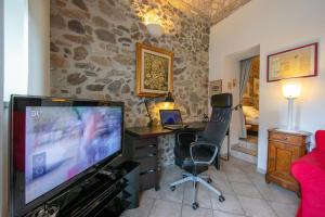TV a/nebo společenská místnost v ubytování Casa Tamè - Happy Rentals