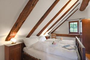 a bedroom with a bed with white sheets and a window at Rustico Alla Bolla - Happy Rentals in Frasco