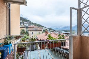 a balcony with a view of a city at Casa Lucia - Iseo Lake View - by HOST4U in Lovere