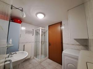 a bathroom with a shower and a toilet and a sink at Casa Vacanze S.Tomaso in Riva del Garda